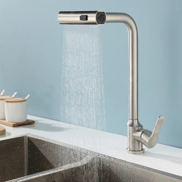 Modern pull-out kitchen faucet with waterfall shower head in a sleek brushed finish, installed over a stainless steel sink.