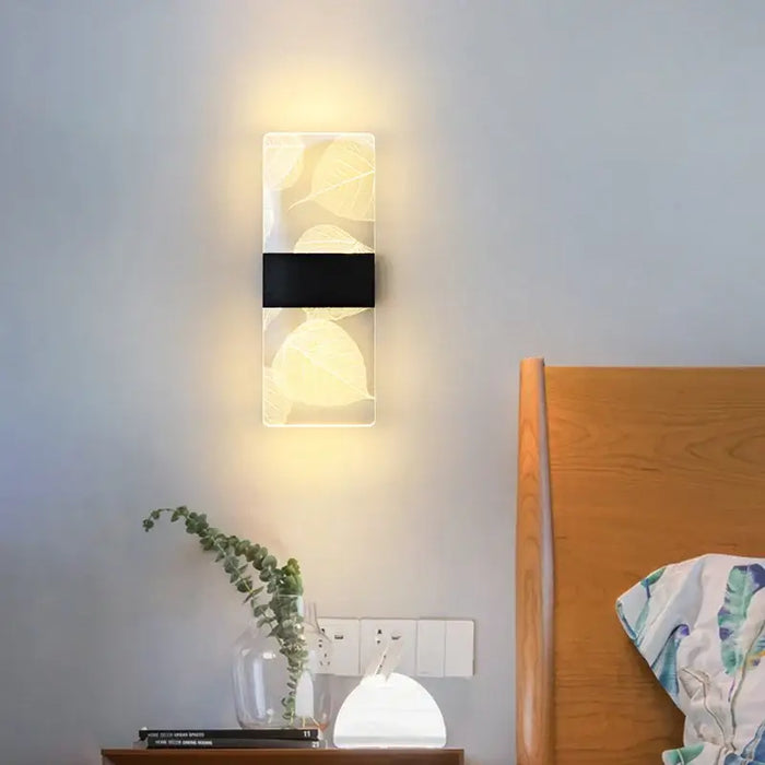 Modern LED Fantasy Wall Lamp in a bedroom, featuring a sleek Nordic design with soft ambient lighting and leaf patterns.