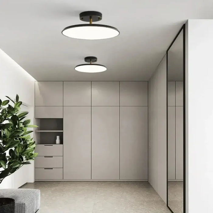 Modern Rotatable LED ceiling light with minimalist design in a sleek, contemporary room setting.