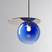 Blue glass pendant lamp with modern design, featuring a round orb casting soft illumination. Ideal for artistic home decor.