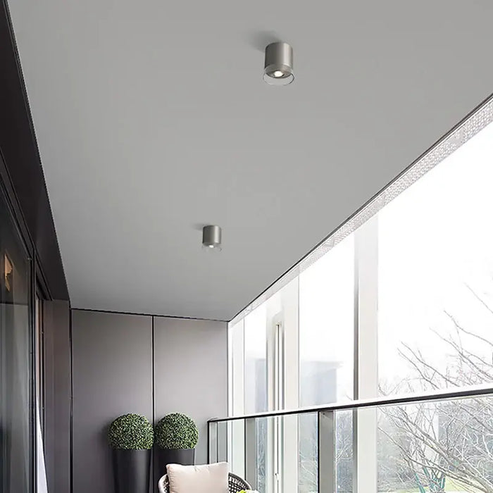 Sleek nickel LED double lens ceiling lights installed on a modern balcony ceiling.