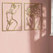 Minimalist woman silhouette line sculptures on pink wall, showcasing elegance and modern decor.