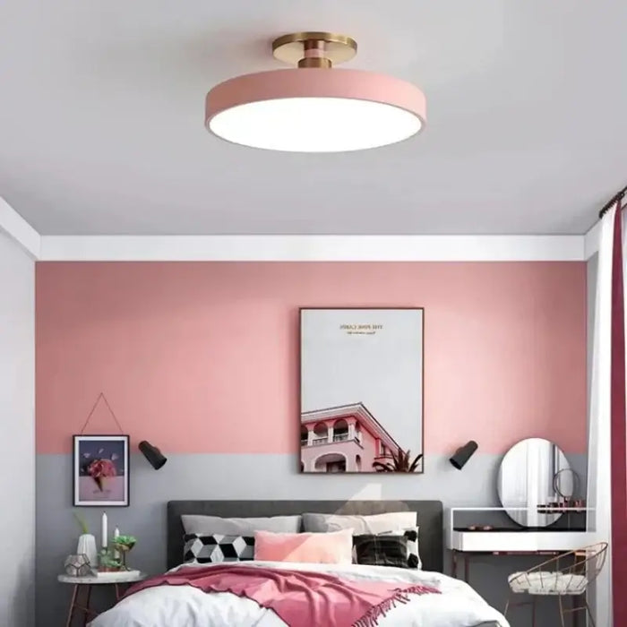 Modern Macaron LED Ceiling Light in pink bedroom, showcasing colorful elegance and contemporary design.