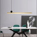 Modern minimalist linear LED bar pendant lamp above dining table in contemporary setting