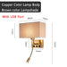 Modern bedside wall lamp with USB port and spotlight, copper body, brown lampshade, dimensions labeled for stylish bedroom lighting.