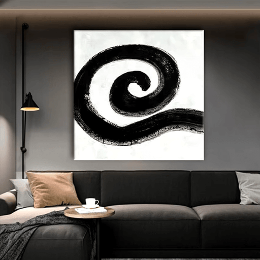 Monochrome spiral abstract canvas art with bold black circle pattern, hand-painted in oil, displayed above a modern living room sofa.