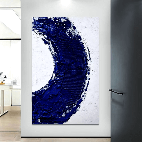 Deep Blue Swirl Abstract Canvas with textured blue swirl on white background, modern oil painting wall art in a bright room.