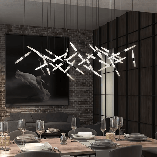 Modern LED Spikes Chandelier Light illuminating a stylish dining room with a unique, contemporary aluminum and acrylic design.