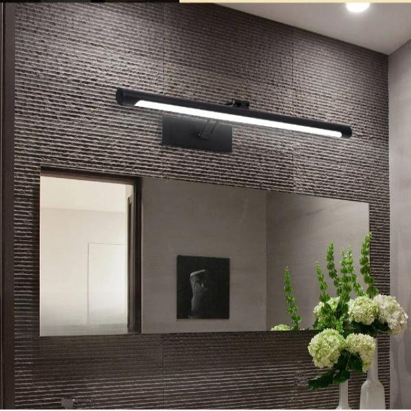 Sleek LED Vanity Mirror Light in modern bathroom with textured wall and floral decor, providing efficient illumination for mirror area.