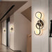 Modern artistic wall lamp with stylish wood finish and versatile LED lighting, enhancing room ambiance with a chic design.