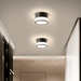 Modern Macaron LED ceiling downlights illuminating a stylish interior hallway with a sleek, Nordic-inspired design.