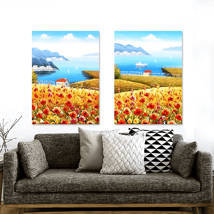 Seaside Floral Landscape Canvas Set with vibrant flowers and coastal view above a grey couch in a modern living room.