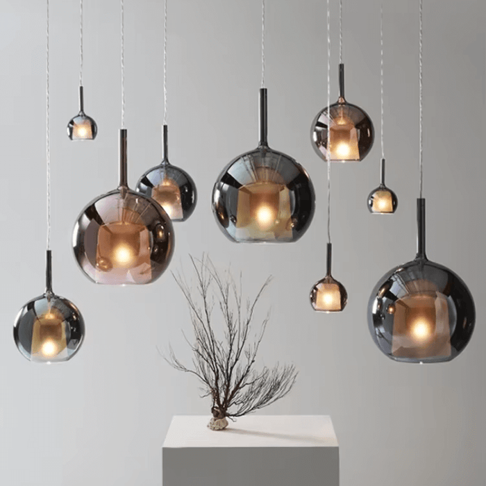 Postmodern Glass Pendant Trio lighting display in various colors and sizes, ideal for contemporary dining or living spaces.