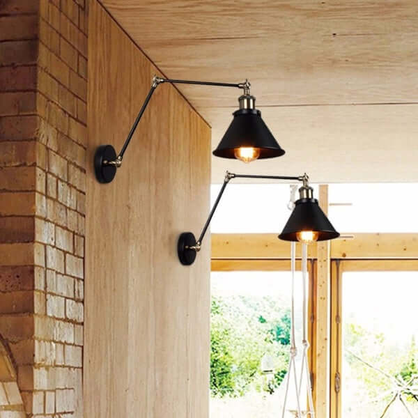 Vintage industrial wall lamp with adjustable design lighting a rustic room with wooden and brick walls.