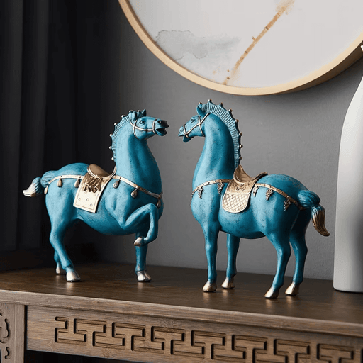 Elegant blue and gold WAR horse sculpture decor on wooden shelf, perfect for home or office, exuding strength and sophistication.